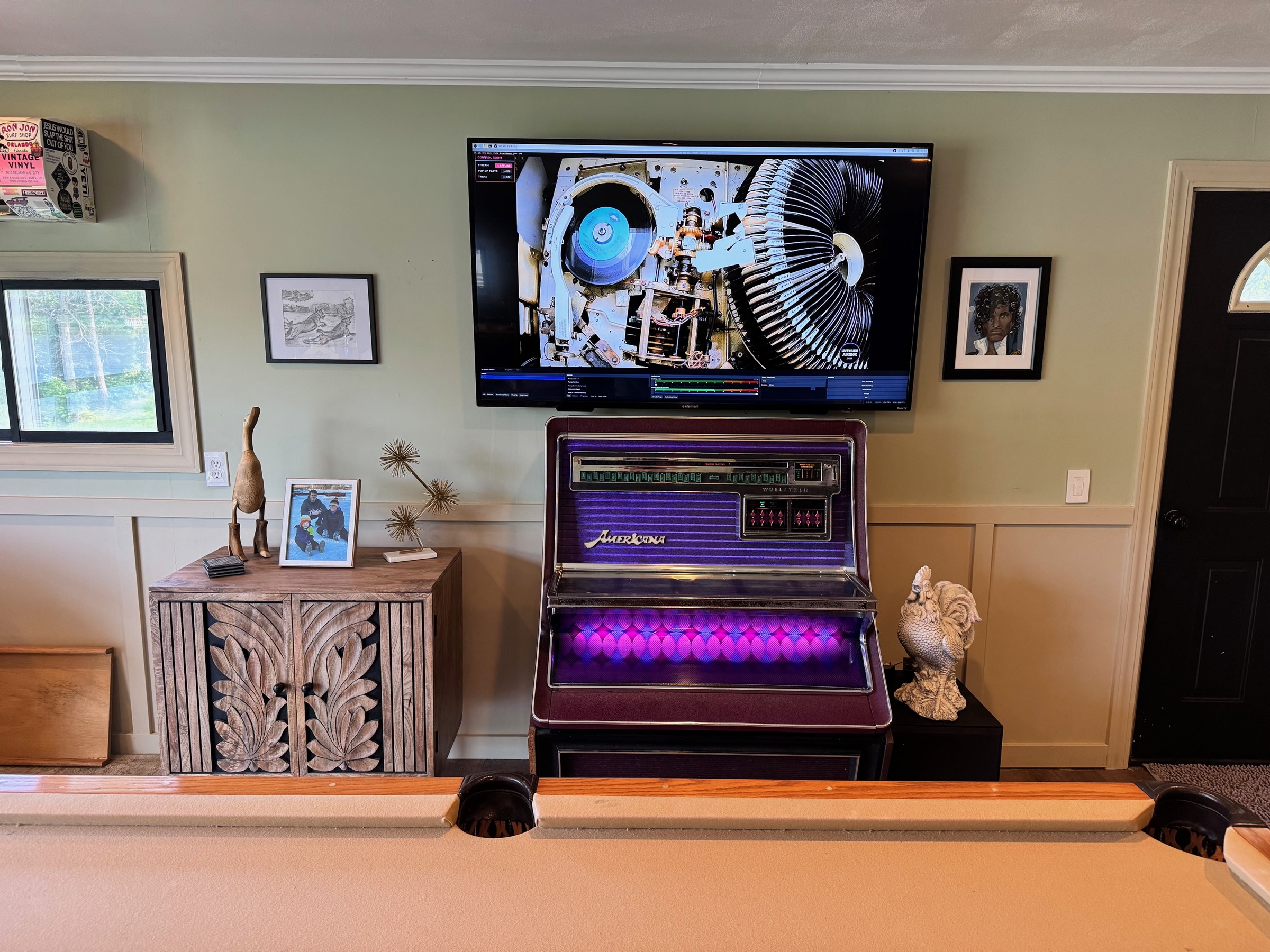 The Wurlitzer Americana glowing purple on the lakefront bar
